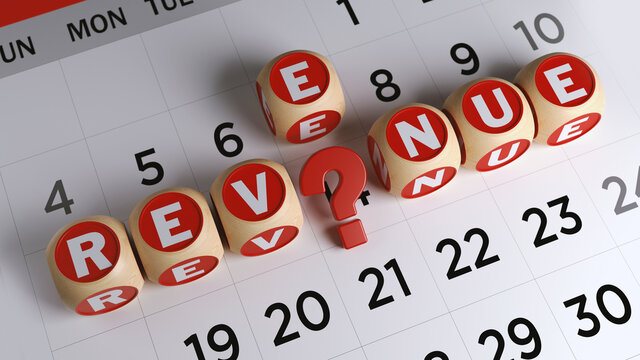 Red-colored question mark symbol and tiny wood blocks with revenue text. On white-colored calendar page. Horizontal composition with copy space. Focused image.