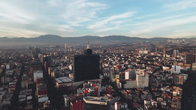 Hyperlapse over mexico city, urban hyperlapse of city with clouds and mountains of cdmx, cinematic footage with drone of timelapse in df