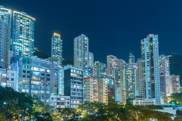 Fototapeta na wymiar high rise residential building in Hong Kong city at night
