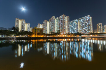 Fototapeta na wymiar High rise residential building of public estate in Hong Kong city at night