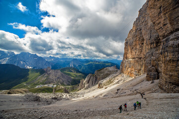 Hikers in Focella Pordoi on Sella Group Dolomite, Trentino, Italy