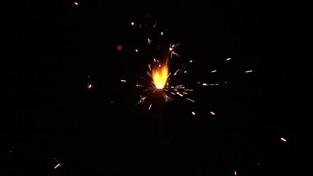 A flare stick burning at night