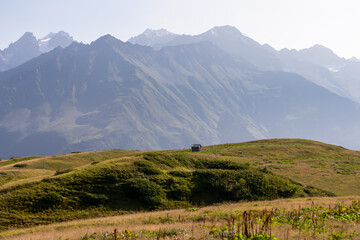 Naklejka premium Amazing view from the Tskahazagari peak on the Svaneti mountain peaks near Mestia in the Greater Caucasus Mountain Range, Upper Svaneti,Country of Georgia.Hiking trail to the Koruldi Lakes.Cottage,hut