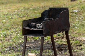 brazier and barbecue on the background of nature