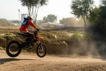 jumping on a motorcycle. motocross. motorcycle racing. bikers on the track