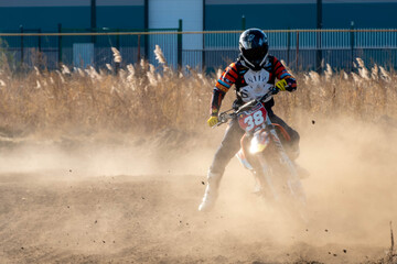 jumping on a motorcycle. motocross. motorcycle racing. bikers on the track