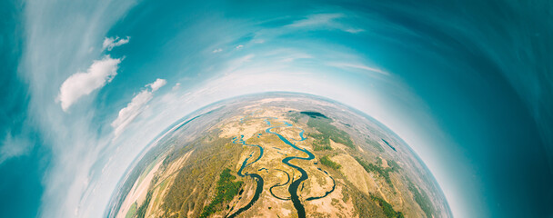 Aerial View Green Forest Woods And River Landscape In Sunny Spring Day. Top View Of Beautiful European Nature From High Attitude. Drone View. Bird's Eye View. Little Small Planet Concept