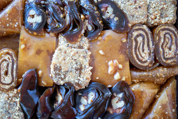 various walnut, pistachio, hazelnut pestils. Turkish deserts. similar to turkish delight.