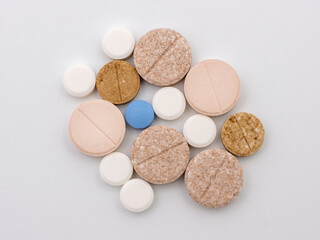 Medicines in colored pills. Top view on white background.