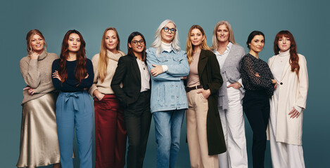 Strong independent women standing in a studio
