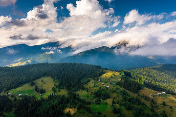 Aerial view of foggy sunrise in the mountains. Carpathian mountains.