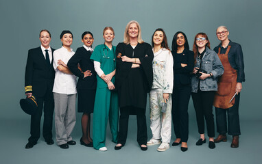 Cheerful female professionals smiling happily in a studio
