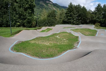 Poster bicycle pumptrack circuit , outdoor race track surrounded by nature in Loudenvielle, France. © jordi