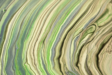 Abstract fluid art background light green and beige colors. Liquid marble. Acrylic painting with olive gradient.