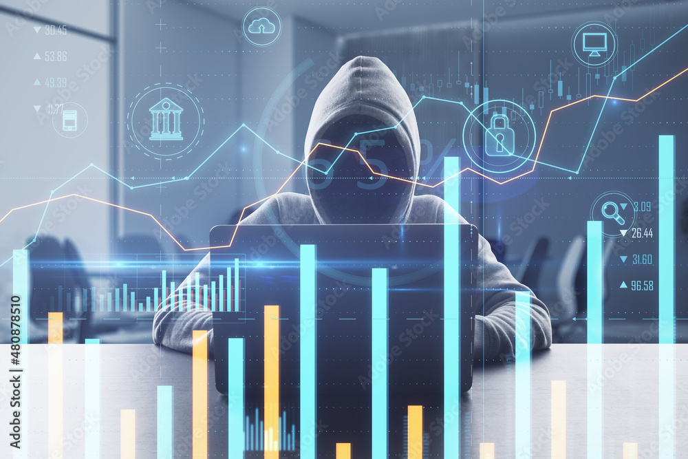 Poster hacker sitting at desktop using laptop with creative glowing business chart on blurry office backgro