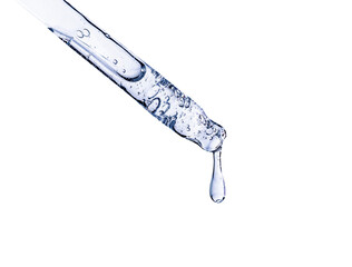 close-up of a serum pipette with a falling drop on a white background