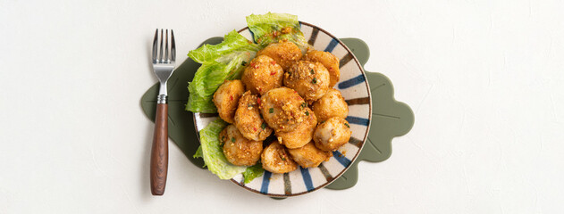 Deep fried cuttlefish ball with salted egg yolk coating