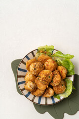 Deep fried cuttlefish ball with salted egg yolk coating