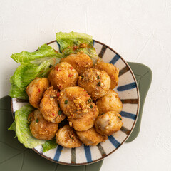 Deep fried cuttlefish ball with salted egg yolk coating