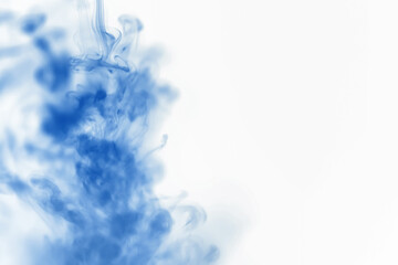 Puffs of paint in water. The dissolution of the dye in water. Water pollution. Concept art creativity.