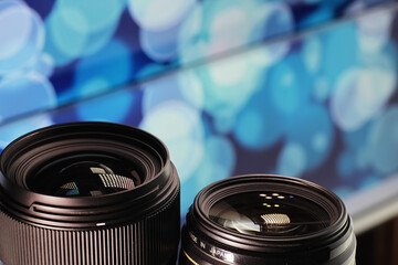 Equipment videographer and photographer. Lenses on the table against the background of bright...