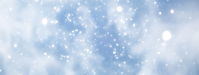 blue snowfall bokeh background, abstract snowflake background on blurred abstract blue