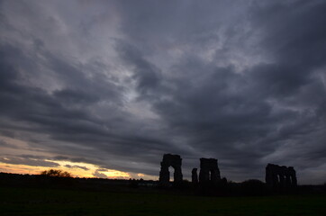 Photos taken at sunset while on a stroll through the beautiful Aqueducts Park in Rome, with the majestic ruins of ancient Roman aqueducts and trees