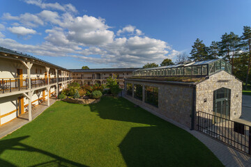 Outdoor hotel area with garden and greenhouse