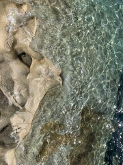 Transparent azure sea water, rocky coastline