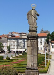 Stone statue in the park with Guimaraes city view, Norte - Portugal 