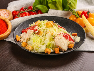 Caesar salad with chicken and cheese