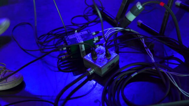 Setting up stage cables for live band show