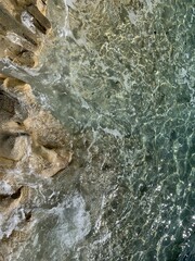 Transparent azure sea water, rocky coastline