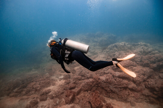 Woman swimming undersea at Del Coco beach