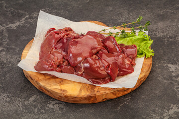 Raw chicken liver over board