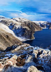 beautiful view of the street. Baikal landscape.  Siberia. Russia. Frozen Lake Baikal. The lake at the beginning of winter. Gulf in December. Open water in the lake, view of the hills and mountain land