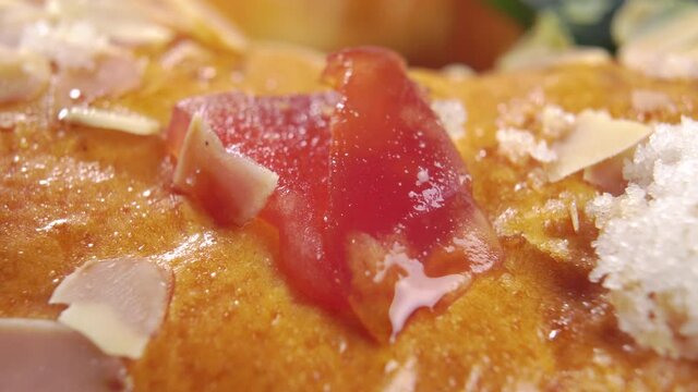 Spanish king cake for Epiphany day. Roscon or rosca de reyes with candied fruits, sugar and nuts. Festive filled traditional bread