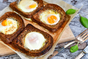 Fried egg on Wholegrain low carb  Toast with cherry tomatoes. Ketogenic  diet healty  food.Traditional French Dish Croque-Madame 