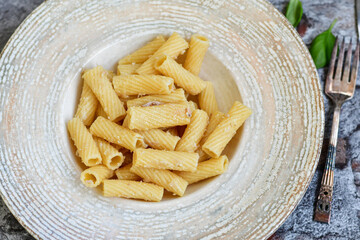  Italian home made  rigatoni   pasta  with  tuna  fish, parmesan cheese and black pepper .