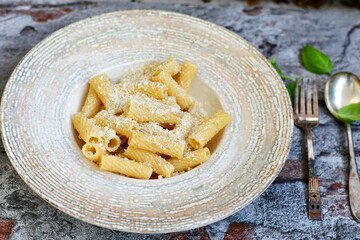  Italian home made  rigatoni   pasta  with  tuna  fish, parmesan cheese and black pepper .