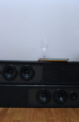 floor speakers with wineglass   