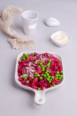 Beetroot pasta with green peas