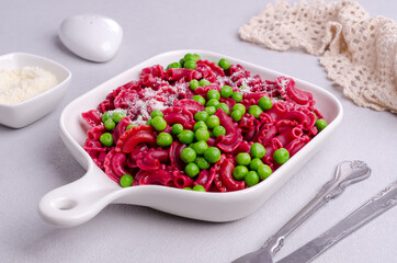 Beetroot pasta with green peas