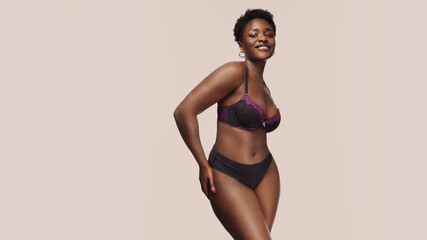 body positive female afro-american woman with an authentic figure - obrazy, fototapety, plakaty