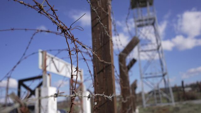 Barbed wife fence and guard tower at a high security prison.