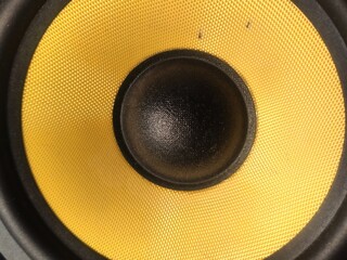 Macro speaker.  Yellow speaker surface.
