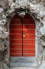 Locked Red Door Built into Rock in Park in Beijing China