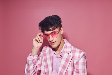 A young man pink shirt and glasses jacket fashion elegant style Lifestyle unaltered