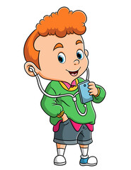 The fashionable boy is listening the music with the headset