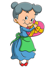 The old woman is holding a love chocolate with the big ribbon